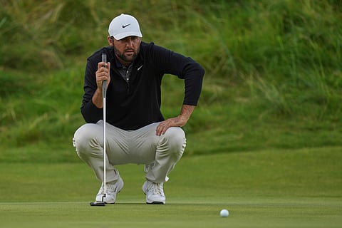 Scottie Scheffler of the United States lines up his putt on the 18th green during the third round of the British Open on Saturday.