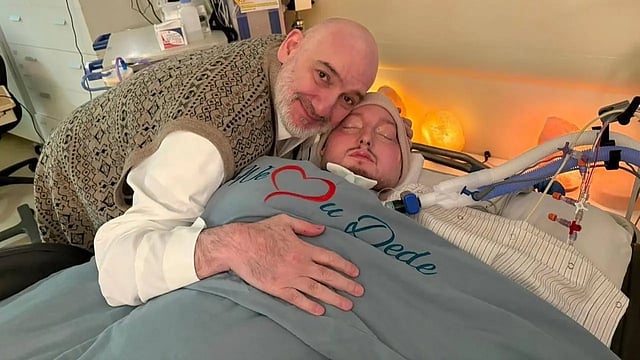 A father's devotion: 20 years by his son's bedside
