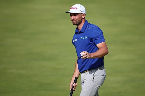 US golfer Wyndham Clark reacts after completing his round on the 18th green on day four of the 153rd Open Championship at Royal Portrush golf club in Northern Ireland on July 20, 2025.
