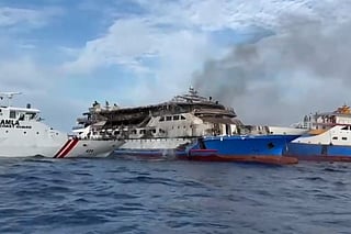 This screen grab taken from video released by Indonesia's National Search and Rescue Agency (BASARNAS) and the Indonesian Coast Guard shows the KM Barcelona 5 ferry after a fire broke out while on its way to Manado, the capital of North Sulawesi province.
