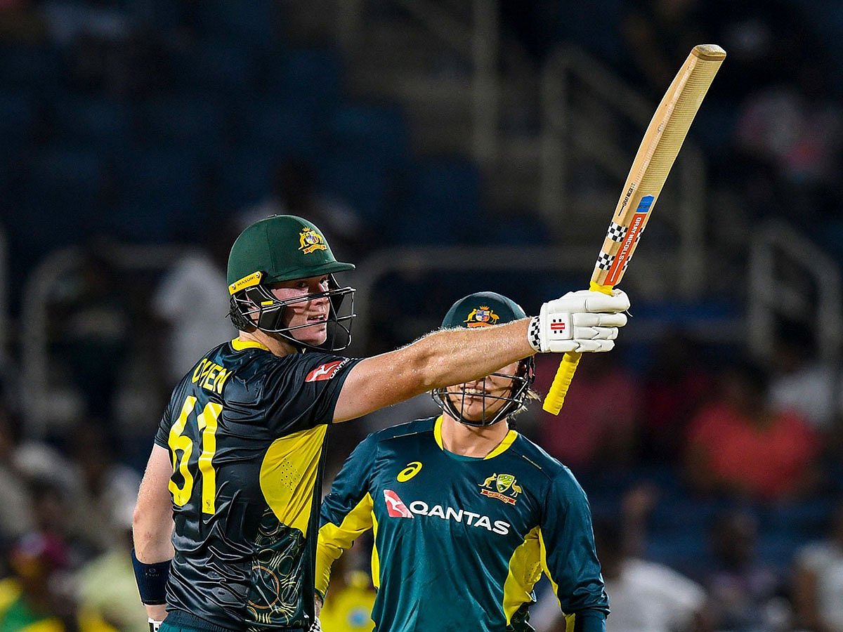 Mitchell Owen (left) of Australia celebrates his half century during the first T20 against West Indies at Sabina Park on Sunday.