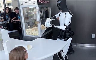 Optimus, a humanoid robot, demonstrates popcorn making — a glimpse into robotics' advancing capabilities. A recent study by McKinsey highlights that automation like this could transform up to 30% of global work activities by 2030.