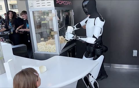 Optimus, a humanoid robot, demonstrates popcorn making — a glimpse into robotics' advancing capabilities. A recent study by McKinsey highlights that automation like this could transform up to 30% of global work activities by 2030.