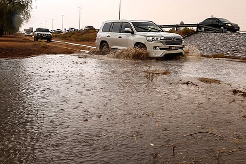People drive their cars off-road through mud puddles amid heavy rainfall on the outskirts of Dubai. Rainfall reaches the outskirts of Al Ain and Dubai — from Margham to Al Lisailli — bringing a rare and refreshing change to the skies.