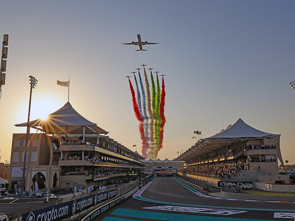 Etihad Airways and the Al Fursan aerobatic team perform a stunning flypast at the start of the Formula 1 Etihad Airways Abu Dhabi Grand Prix 2023 at Yas Marina Circuit.