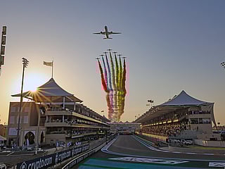 Etihad Airways and the Al Fursan aerobatic team perform a stunning flypast at the start of the Formula 1 Etihad Airways Abu Dhabi Grand Prix 2023 at Yas Marina Circuit.