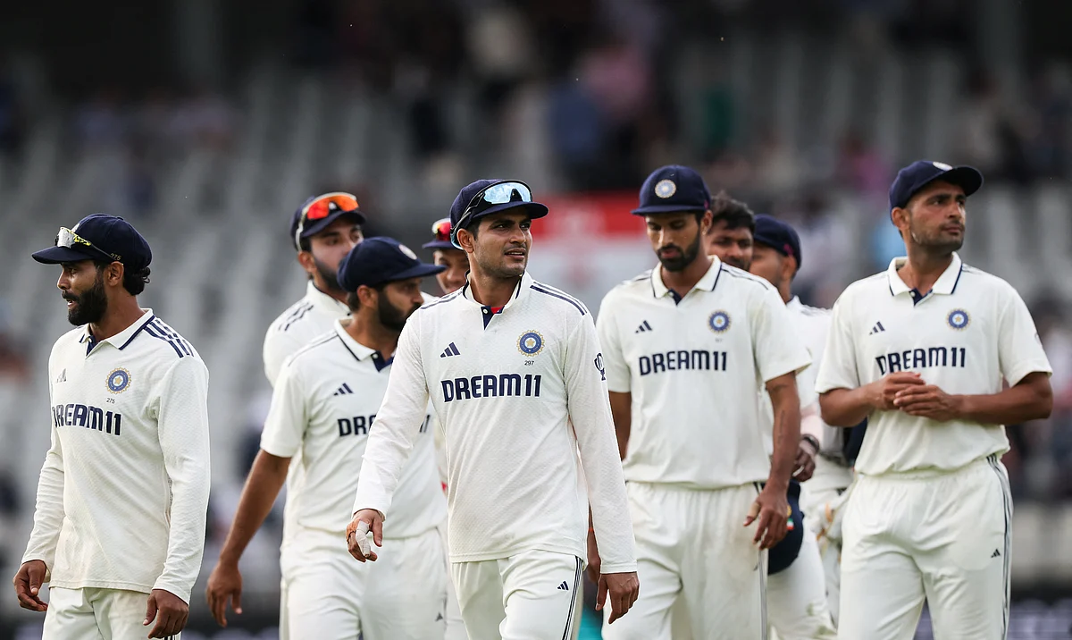 India's captain Shubman Gill (centre) and teammates leave the pitch at the end of day three of the fourth Test against England at Old Trafford.