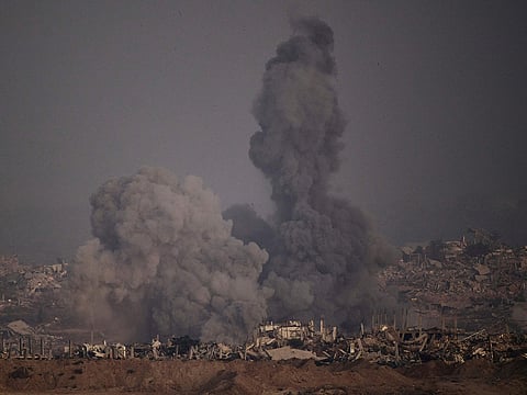 Smoke rises to the sky following an Israeli airstrike in the northern Gaza Strip as seen from southern Israel, on Saturday, July 26, 2025. 