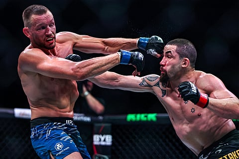 Robert Whittaker and the Netherlands' Reinier de Ridder compete in their men's middleweight fight at the UFC Fight Night event at Etihad Arena in Abu Dhabi on Saturday.