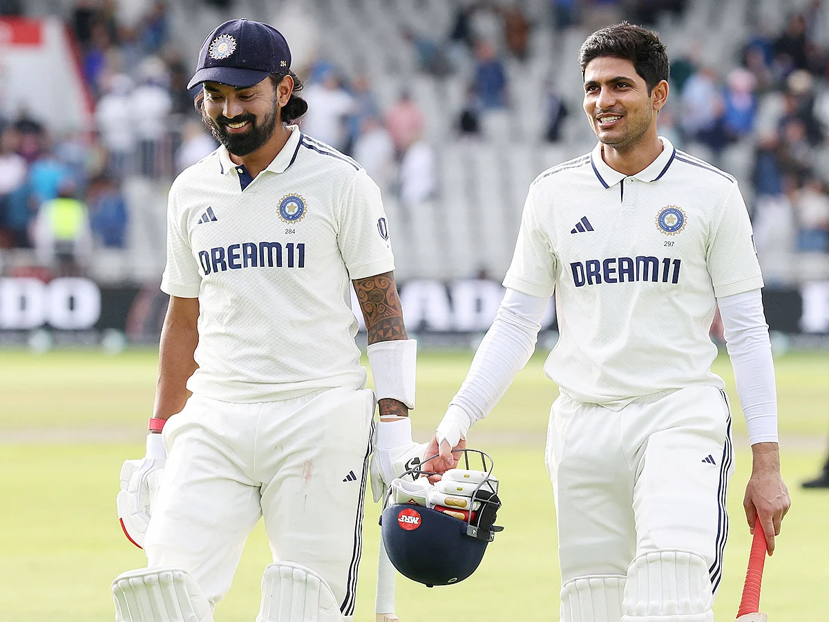 India's KL Rahul (L) walks off the field with captain Shubman Gill (R) at the end of play on day four of the fourth Test against England at Old Trafford, in Manchester, north England, on July 26, 2025. 