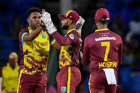 Shai Hope (second from left) celebrates with Jediah Blades during the Twenty20 international. The West Indian skipper feels the bowlers did their job and the batting let the team down.