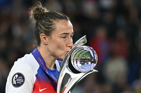 England's defender Lucy Bronze kisses the trophy as they celebrate winning the Uefa Women's Euro 2025 final football match against Spain at the St. Jakob-Park Stadium in Basel, on July 27, 2025.