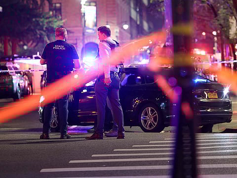 Police work at the scene of a fatal shooting in midtown Manhattan on July 28, 2025 in New York City. 