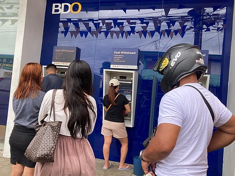 The peso's decline in the last three months (May to July 2025) reverses  its relatively stable performance, earlier in the year. Photo shows customers forming a beeline to a local ATM machine. 