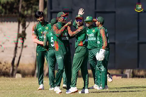 Bangladesh players celebrate a Zimbabwe wicket