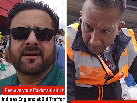A security man tells a cricket fan to remove Pakistan team jersy during the England-India test match at Old Trafoord Statdium in Manchester.