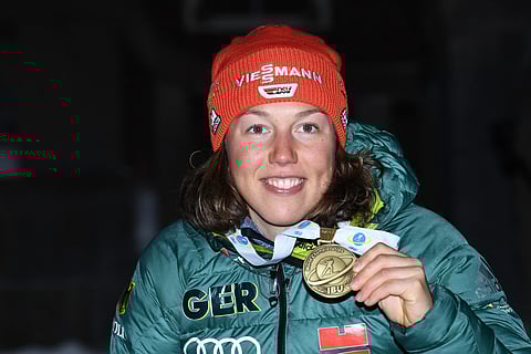 German Biathlete Laura Dahlmeier celebrates during the medal ceremony of the women's 10km pursuit competition at the IBU Biathlon World Championships in Ostersund, Sweden, on March 10, 2019.