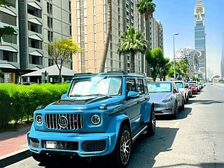 It's a head-turning 4WD monster with a Brabus kit, wrapped in a rare bluish finish and bold orange leather inside.