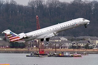 FILE - Salvage crews work on recovering wreckage near the site in the Potomac River of a mid-air collision between an American Airlines jet and a Black Hawk helicopter at Ronald Reagan Washington National Airport, Thursday, Feb. 6, 2025, in Arlington, Virginia.