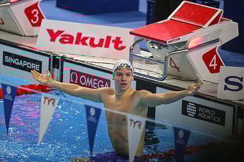 France's swimmer Leon Marchand reacts after winning a semi-final of the men's 200m individual medley swimming event and breaking the world record during the 2025 World Aquatics Championships in Singapore on July 30, 2025.