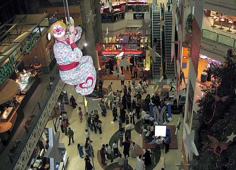 Shoppers often paused in delight at Lamcy Plaza, where a cheerful clown climbs up and down a tightrope, bringing smiles and a touch of magic to the mall.