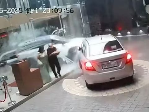 An SUV crashes through the glass entrance of a hotel in Bareilly, Uttar Pradesh.