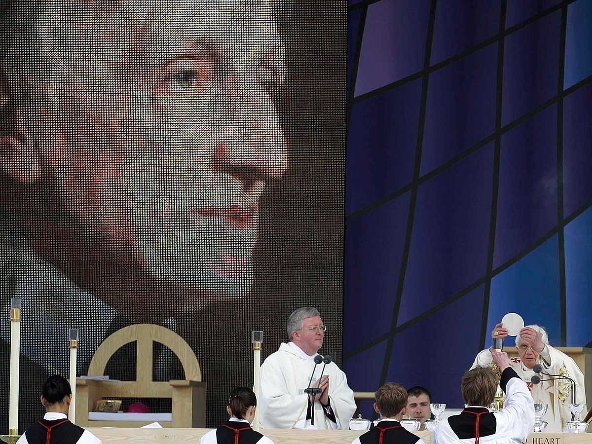 File: Pope Benedict XVI, right, celebrates a beatification mass for Cardinal John Henry Newman in Birmingham, England, Sunday, Sept. 19, 2010.