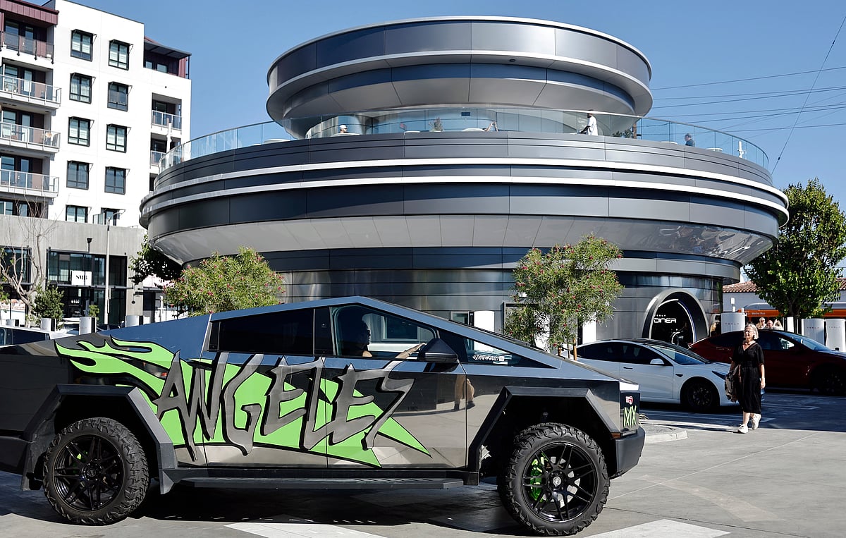 A Tesla Cybertruck drives outside the newly opened Tesla Diner on July 31, 2025 in Hollywood, California.