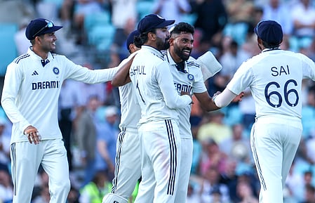 Mohammad Siraj celebrates with teammates.