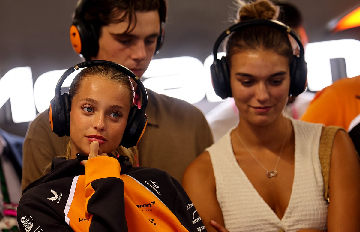 Margarida Corceiro (left), Portuguese television actress and model and girlfriend of McLaren's British driver Lando Norris follows the race during the Formula One Hungarian Grand Prix at the Hungaroring circuit in Mogyorod near Budapest.