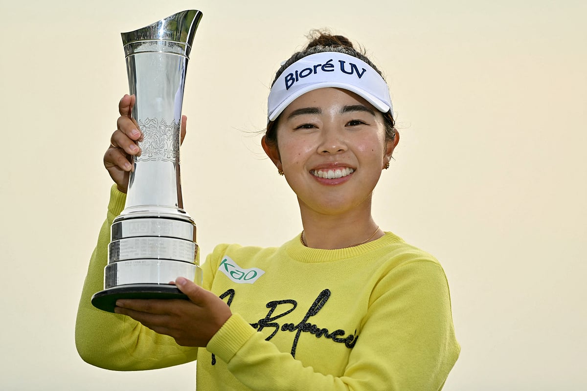 Japan's Miyu Yamashita lifts the trophy after winning on the final day of the Women's British Open Golf Championship, at Royal Porthcawl in south Wales on August 3, 2025.