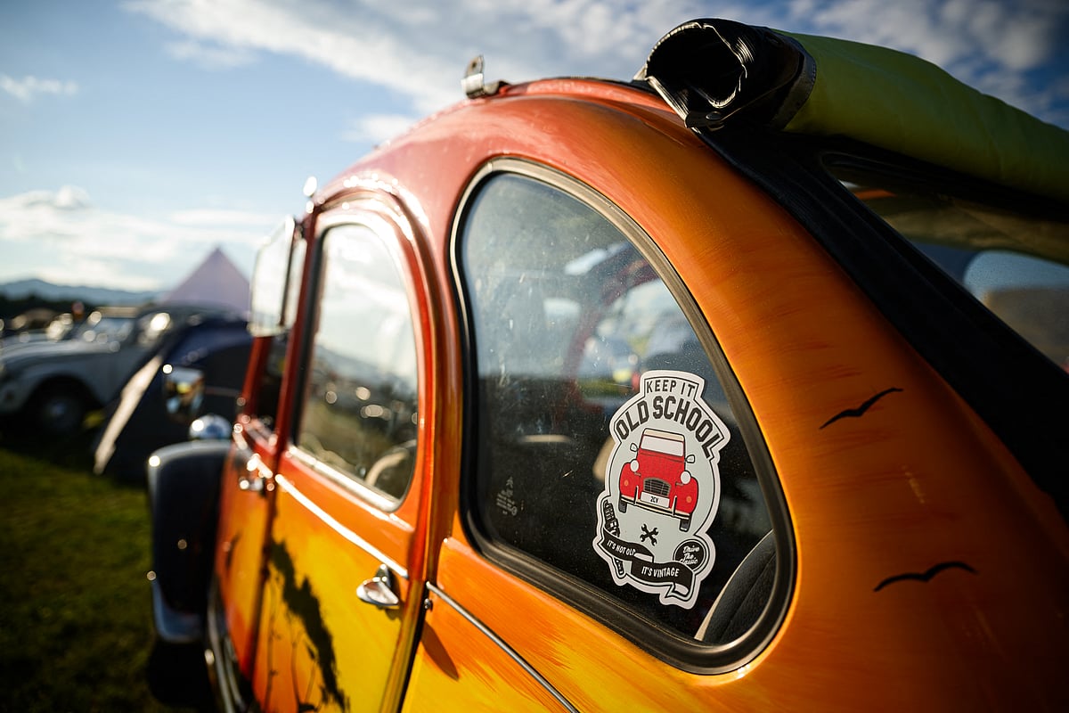 This photograph shows a sticker sticked on a Citroen 2CV vehicle, parked at a camp during the 25th World Meeting of 2CV Friends in Postojna, Slovenia on July 30, 2025.