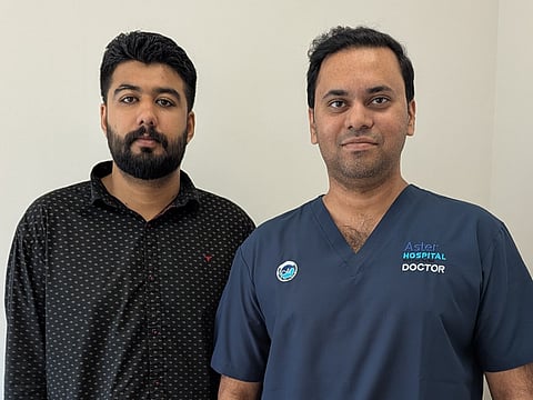 Muhammad Bilal with Dr Roshan Rodney S at Aster Hospital Mankhool after successful treatment.