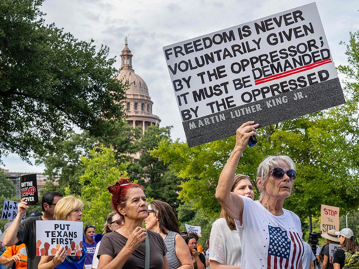 People protest against the recently introduced redistricting legislation during an emergency march and picket rally outside of the Governor's Mansion on August 04, 2025 in Austin, Texas.