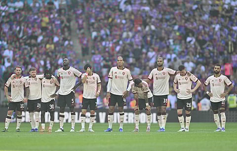 Liverpool players look forward to the penalty shoot out during the Community Shield match against Crystal Palace at Wembley Stadium on Sunday.
