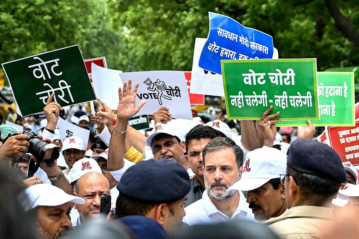 Indian National Congress (INC) party leader Rahul Gandhi (C) takes part in a protest led by India's opposition parties in New Delhi on August 11, 2025, to condemn alleged electoral malpractices and the Special Intensive Revision (SIR) of electoral rolls ahead of state elections in India's Bihar state.