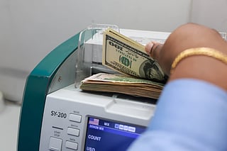 File photo of currency exchange. Asian currency dip boosts remittance returns for UAE workers.