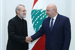 Lebanon's President Joseph Aoun (right) meets with Iran's head of the National Security Council Ali Larijani and a delegation at the Presidential Palace in Baabda on August 13, 2025.