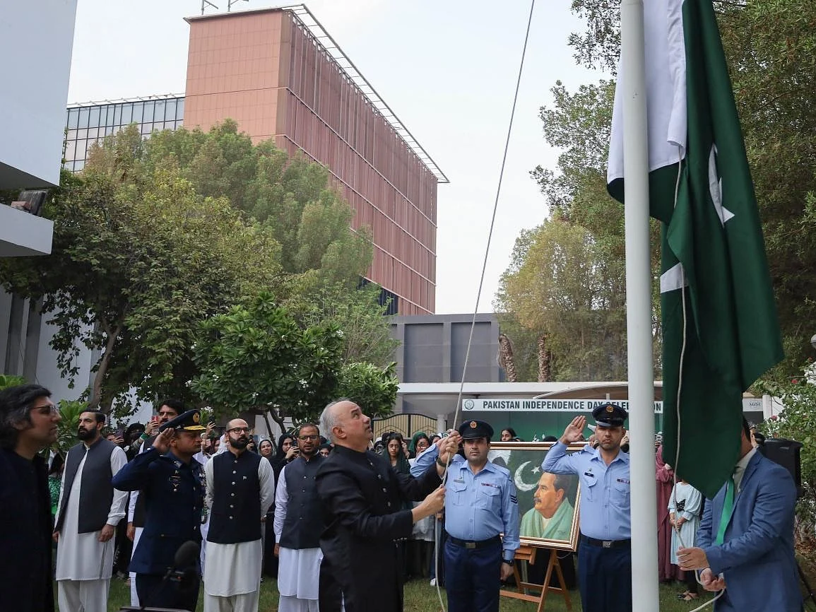 Pakistan’s Ambassador to the UAE Faisal Niaz Tirmizi hoists the national flag at the embassy in Abu Dhabi.