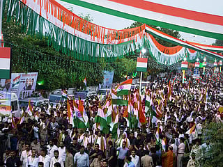 People participate in Tiranga Yatra or tricolour march ahead of Independence Day in Ahmedabad, India, Wednesday, August 13, 2025. 