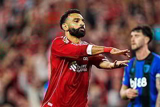 Liverpool's Mohamed Salah pays a tribute to Diogo Jota after scoring his side's fourth goal in the Premier League opener against Bournemouth at Anfield on Friday.