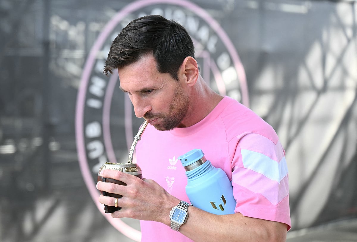 Inter Miami's Argentine forward #10 Lionel Messi sips his Yerba Mate drink. 