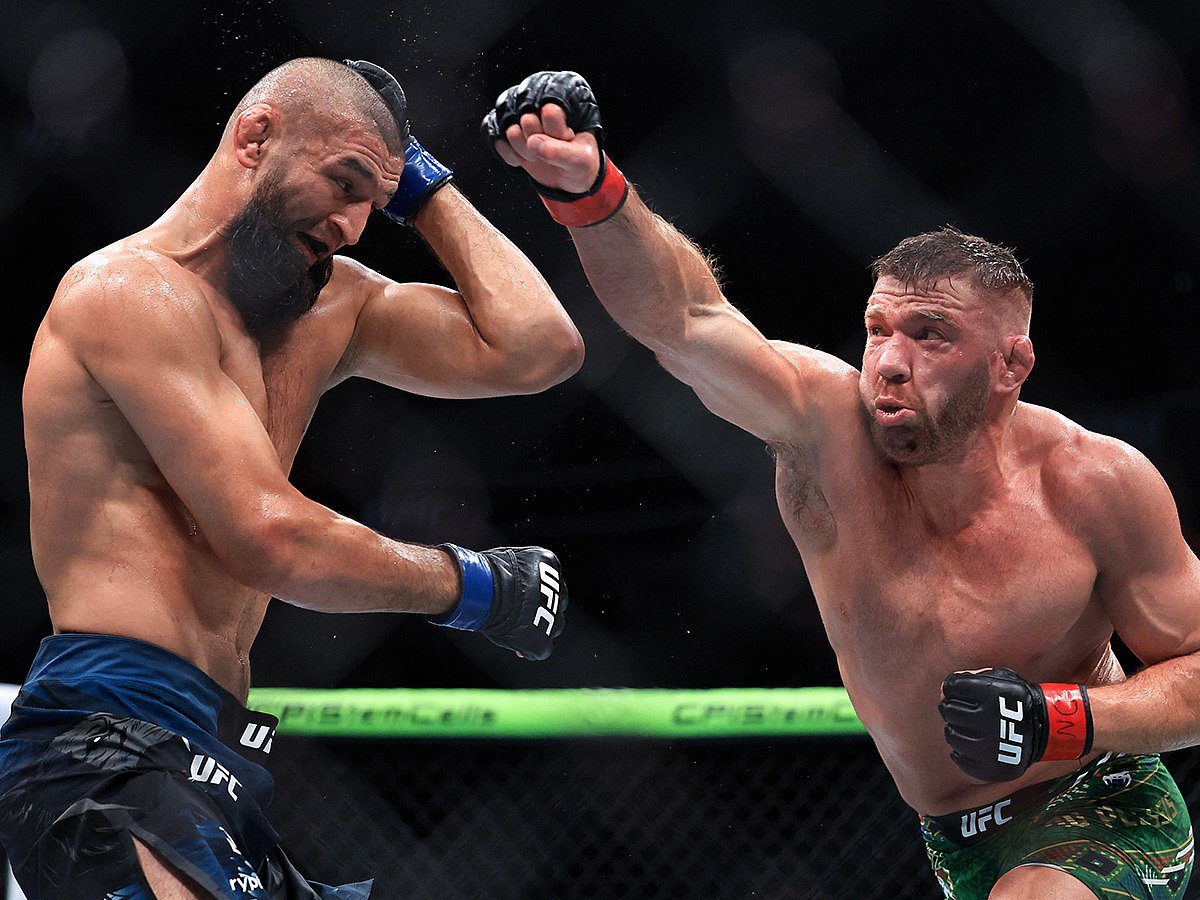 Dricus du Plessis of South Africa strikes Khamzat Chimaev of the United Arab Emirates during their middleweight title bout in UFC 319 at the United Center on August 16, 2025 in Chicago, Illinois.