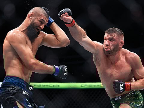 Dricus du Plessis of South Africa strikes Khamzat Chimaev of the United Arab Emirates during their middleweight title bout in UFC 319 at the United Center on August 16, 2025 in Chicago, Illinois.