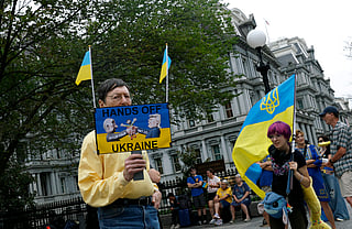 Ukraine supporters participate in a rally outside of the Eisenhower Executive Office Building near the White House on August 18, 2025 in Washington, DC. U.S. President Donald Trump is hosting Ukraine President Volodymyr Zelensky and other European leaders to discuss a peace deal between Russia and Ukraine aimed at ending the war in Ukraine.