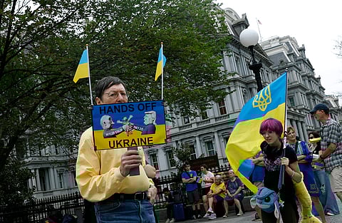 Ukraine supporters participate in a rally outside of the Eisenhower Executive Office Building near the White House on August 18, 2025 in Washington, DC. U.S. President Donald Trump is hosting Ukraine President Volodymyr Zelensky and other European leaders to discuss a peace deal between Russia and Ukraine aimed at ending the war in Ukraine.