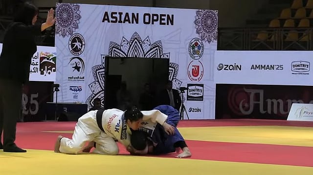 Pakistani judoka Malaika Noor (left) in action during her match at the Asian Open Judi Championship in Jordan.