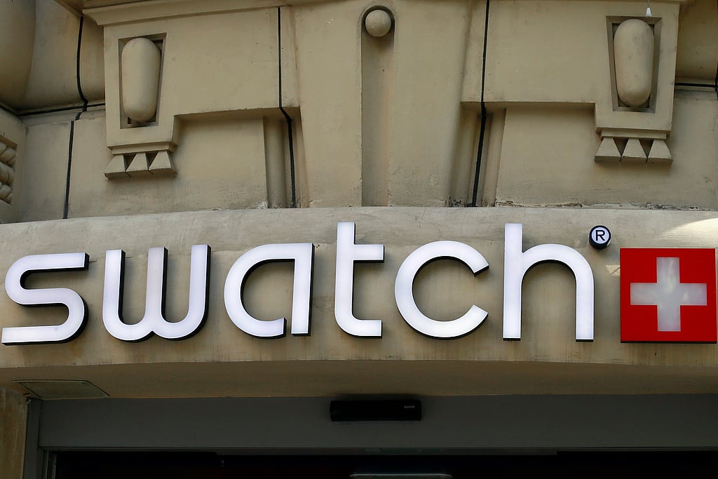 The logo of Swiss watchmaker "Swatch" is pictured on the Champs Elysees Avenue in Paris, France, Wednesday, Sept. 20, 2017. 