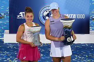 Jasmine Paolini of Italy (L) and Iga Swiatek of Poland pose with the Rookwood Cups after Swiatek defeated Paolini to win the women's singles final during Day 12 of the Cincinnati Open at the Lindner Family Tennis Center on August 18, 2025 in Mason, Ohio.