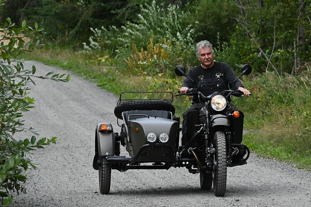 Alaska resident Mark Warren rides the a new Ural motorcycle he received as a gift from the Russian government in Anchorage, Alaska, Monday, Aug. 18, 2025, after Russian President Vladimir Putin's visit to the state for a summit meeting with U.S. President Trump. 